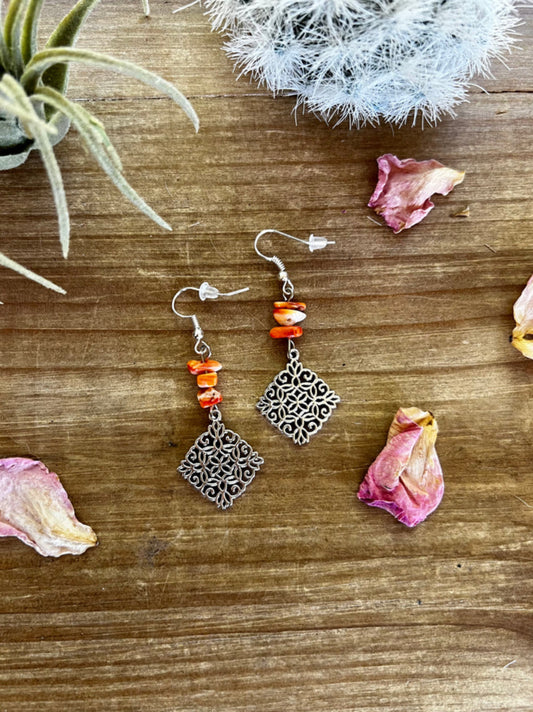 Orange spiny dangle earrings